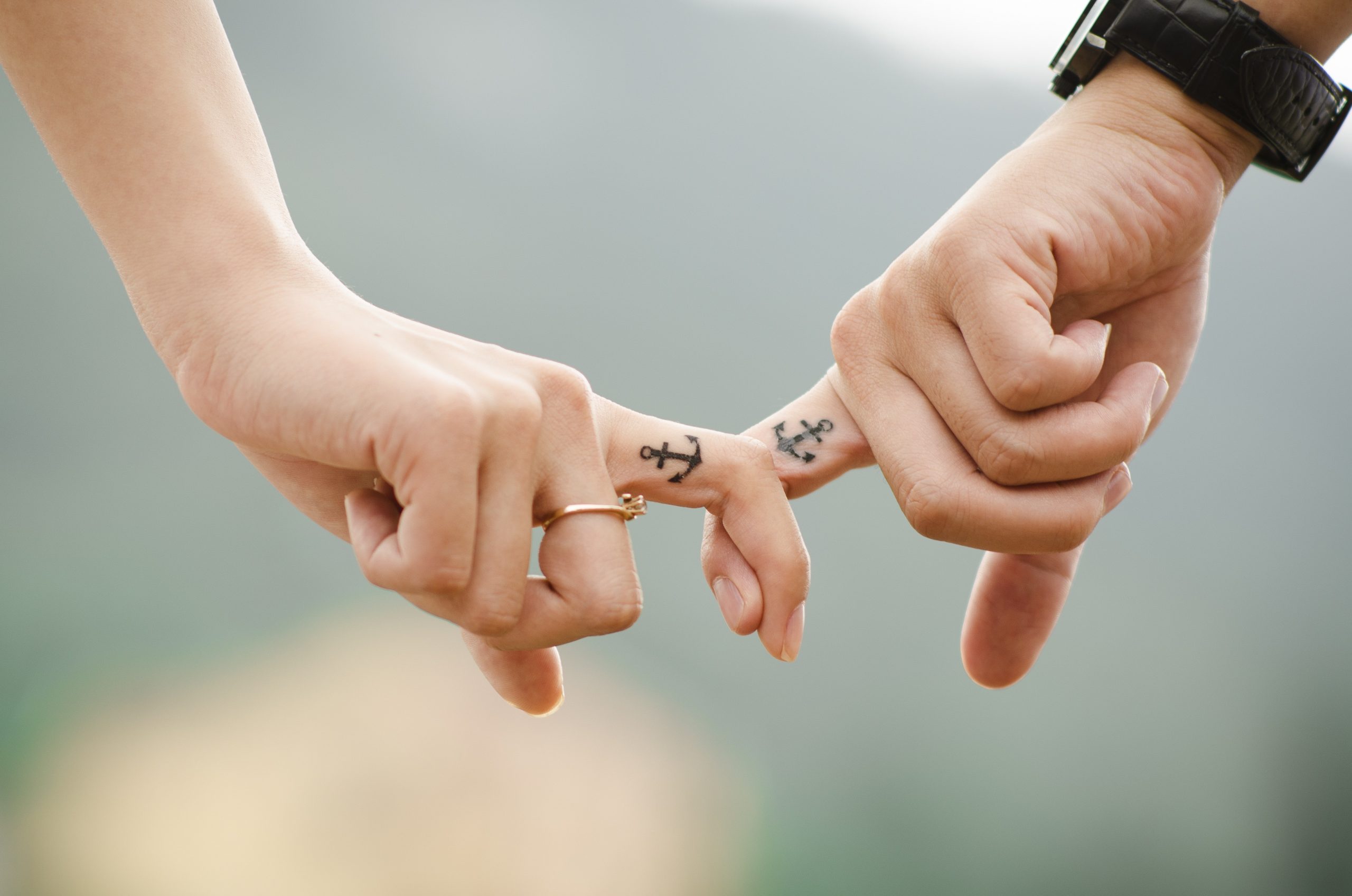 couple holding hands andrea bond